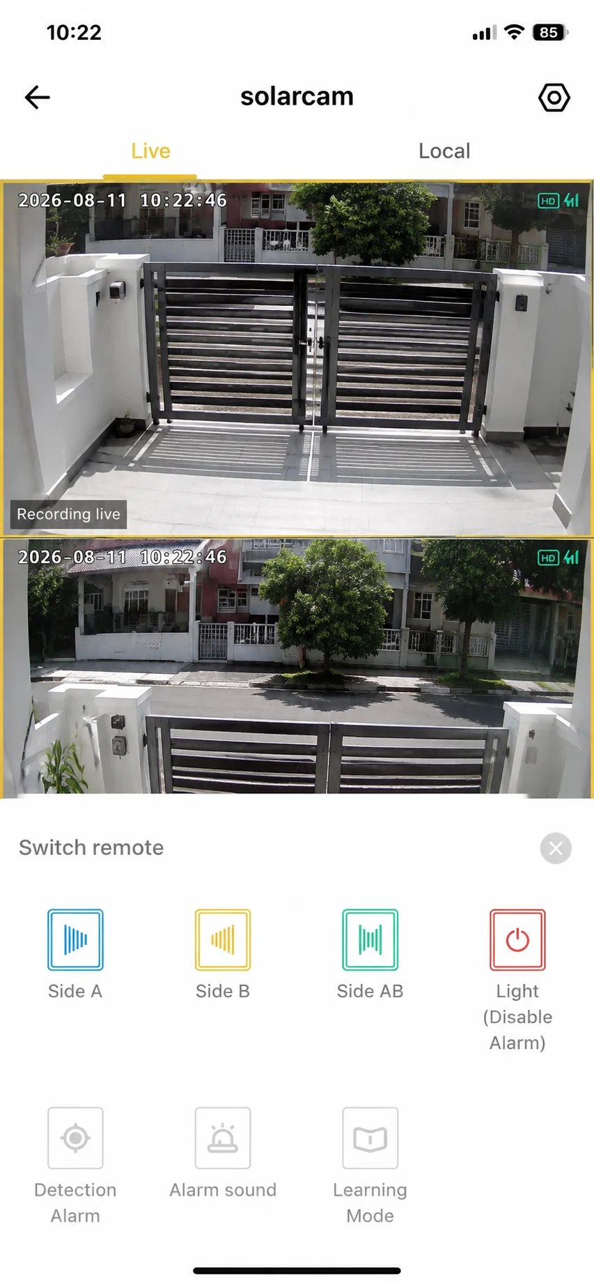 The DNOR app showing a dual-lens live view of a gate and the Switch remote controls